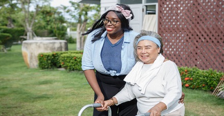 caregiver supporting an special woman